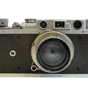 Vintage 35mm screw-mount rangefinder camera with collapsible lens