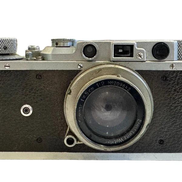 Vintage 35mm screw-mount rangefinder camera with collapsible lens